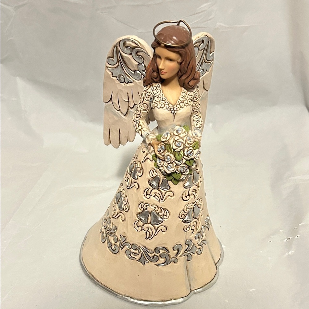 Jim Shore 25th anniversary figurine.